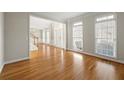 Hardwood floor living room with an open floor plan and lots of natural light at 7250 Weber St, Atlanta, GA 30349