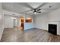 Open concept living room with kitchen view and fireplace at 4146 Shoals Pt, Union City, GA 30291