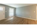 Spacious living room featuring hardwood floors and large window at 3597 Fairlane Nw Dr, Atlanta, GA 30331