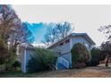 Gray sided house with white steps and landscaping at 4557 Greenleaf Sw Cir, Atlanta, GA 30331