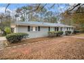 Ranch house with gray exterior and landscaping at 844 Parkstone Dr, Stone Mountain, GA 30083