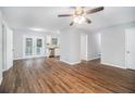 Open living space with hardwood floors and access to kitchen at 844 Parkstone Dr, Stone Mountain, GA 30083