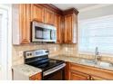 Granite countertops and stainless steel appliances in kitchen at 3166 Cloverhurst Dr, Atlanta, GA 30344