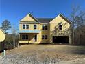 Two-story yellow house with a large garage and a covered porch at 171 Silvercrest Dr, Acworth, GA 30101