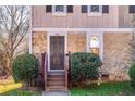 Front entrance with stone accents and steps leading to the door at 341 Red Oak Sw Run, Marietta, GA 30008