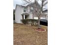 Two-story house with gray siding, brick accents, and landscaping at 105 Birch St, Hiram, GA 30141