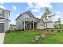 Two-story house with gray siding, landscaping, and a two-car garage at 3340 Redwood Ct, Covington, GA 30016