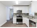 Renovated kitchen with granite countertops and stainless steel appliances at 2452 Semmes St, Atlanta, GA 30344