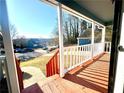 Inviting front porch with wooden deck and view of neighborhood at 3945 Peninsula Ct, Lawrenceville, GA 30044