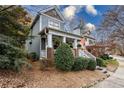 Gray siding two-story home with brick accents and a charming front porch at 1337 Benteen Park Se Dr, Atlanta, GA 30315