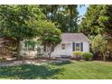 Cute white house with a well-maintained lawn and landscaping at 1891 8Th St, Brookhaven, GA 30341