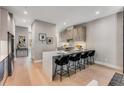 Modern kitchen with island, quartz countertops, stainless steel appliances, and hardwood floors at 1099 North Ne Ave # 11, Atlanta, GA 30307