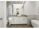 Elegant bathroom with double vanity and free-standing tub at 241 Maynard Se Ter # 14, Atlanta, GA 30316