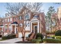 Attractive three-story townhome with brick exterior and a two-car garage at 5877 Riverstone Cir # 17, Atlanta, GA 30339