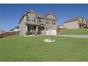 Landscaped lawn, two-story house with stone and shingle accents, and a basketball goal at 2790 Ridge Manor Dr, Dacula, GA 30019