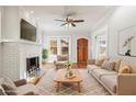 Living room with fireplace, hardwood floors and comfy furniture at 1015 Deckner Sw Ave, Atlanta, GA 30310