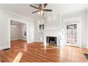 Bright living room with hardwood floors, fireplace and large windows at 1015 Deckner Sw Ave, Atlanta, GA 30310