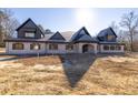 Large brick house with a gabled roof and dormers at 1730 Etchison Spur, Loganville, GA 30052