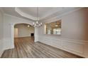 Bright dining room with hardwood floors and a view into the living room at 349 Southgate Dr, Locust Grove, GA 30248