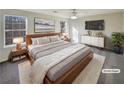 Virtually staged main bedroom with large bed and dresser at 2701 Michelle Lee Dr, Dacula, GA 30019