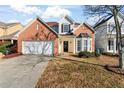 Two-story house with a brick facade and a spacious yard at 6469 Alder Ln, Norcross, GA 30093
