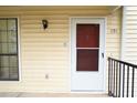 Condo's front door with security features at 691 Windchase Ln, Stone Mountain, GA 30083