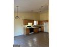 View of the kitchen with appliances and a breakfast area at 1011 Riverclift Dr, Covington, GA 30016