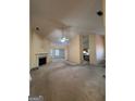 Bright living room featuring a fireplace and vaulted ceilings at 1011 Riverclift Dr, Covington, GA 30016