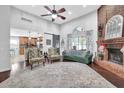 Spacious living room with fireplace, hardwood floors, and a view into the kitchen at 3747 Misty Wood Nw Dr, Marietta, GA 30064