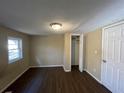Spacious bedroom with ample closet space and dark laminate flooring at 4195 Blanton Sw Ave, Atlanta, GA 30331