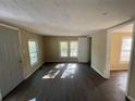 Bright living room with dark laminate flooring and neutral walls at 4195 Blanton Sw Ave, Atlanta, GA 30331