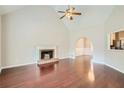 Spacious living room featuring hardwood floors, a fireplace, and high ceilings at , Acworth, GA 30101