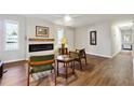 Living room with hardwood floors, fireplace, and mid century seating at 8 Regency Se Way, Mableton, GA 30126