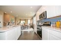 Modern kitchen with stainless steel appliances and island at 146 Oakchase Park Ln, Hampton, GA 30228