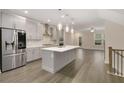 Modern kitchen with gray cabinets, quartz countertops, and stainless steel appliances at 2065 Morrison Ave, Brookhaven, GA 30319