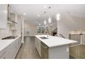Open concept kitchen with island, stainless steel appliances, and gray cabinets at 2065 Morrison Ave, Brookhaven, GA 30319