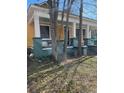 Yellow house with wrap-around porch and mature trees at 1786 Lakewood Ave, Atlanta, GA 30315
