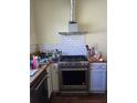 Renovated kitchen with stainless steel appliances and white cabinets at 1839 Lakewood Ave, Atlanta, GA 30315