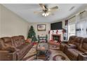 Living room with fireplace, hardwood floors, and seating area at 2001 Commonwealth Way, Grayson, GA 30017