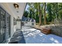 Private backyard oasis with a patio and stone retaining wall at 2340 Highview Sw Rd, Atlanta, GA 30311