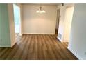 Bright dining area with laminate flooring and chandelier at 5157 Roswell Rd # 9, Atlanta, GA 30342