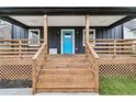 Inviting front porch with wooden stairs and railings at 2447 Lynn Iris Dr, Decatur, GA 30032