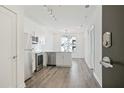 Open concept kitchen with stainless steel appliances and hardwood floors at 525 Parkway Ne Dr # 217, Atlanta, GA 30308