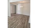 Bright dining room with wood-look flooring and a chandelier at 2822 Saratoga Lake Vw, Decatur, GA 30034