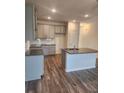 Modern kitchen with gray cabinets, granite counters, and an island at 2822 Saratoga Lake Vw, Decatur, GA 30034