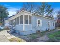 Light blue house with screened porch, side yard, and AC unit at 569 Martin Se St, Atlanta, GA 30312