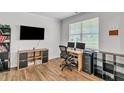 Home office with built-in shelving and two computer stations at 4929 Calgary Dr, Douglasville, GA 30135