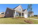 Gray siding house with a side view showcasing the landscaping and driveway at 71 Colonial Terrace, Villa Rica, GA 30180