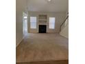 Spacious living room featuring a fireplace and ample natural light at 539 Greyhawk Way, Fairburn, GA 30213