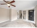 Living room with neutral decor and access to stairs at 3265 Newcastle Way, Snellville, GA 30039